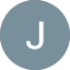 Depoimentos Clientes Blanc Vans Julio Farias Avatar with the initial J on a blue-gray circular background.